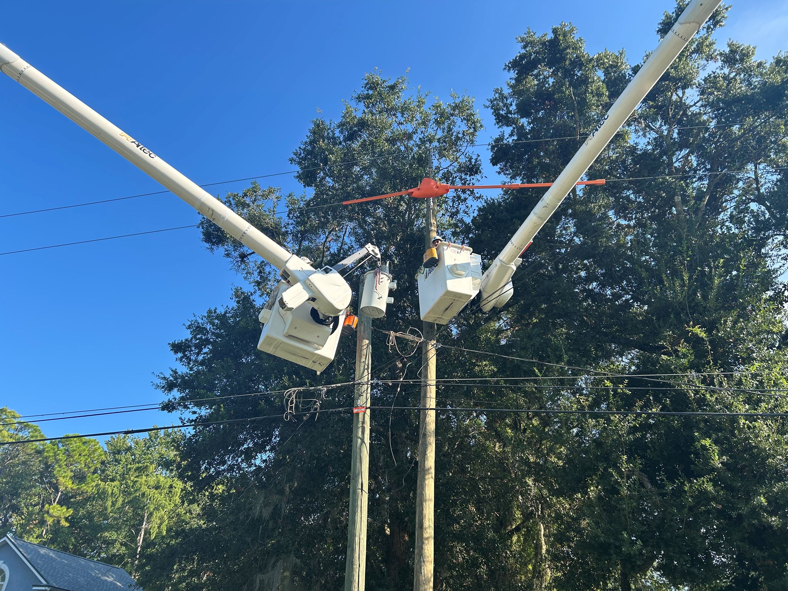 Electric crews completing voltage conversion on Blackmon Road.